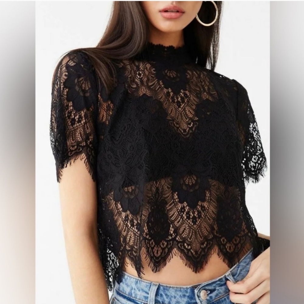A see-through crop top in black